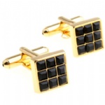 Gold and black cufflink